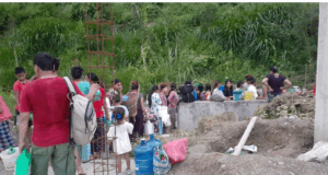 Hours in queue for a jar of water in Damauli